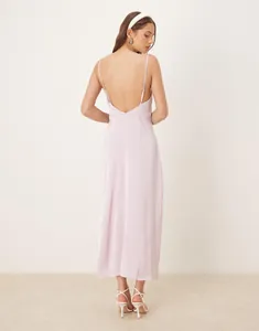 Detailed back view of an elegant light pink satin maxi slip dress with a low back design.