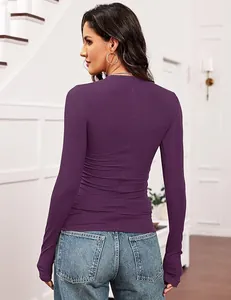 Close-up back view of a slim fit purple ribbed knit long sleeve top with textured fabric.