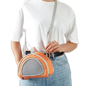 Portable small pet carrier bag for hamsters and hedgehogs shown on a female model.