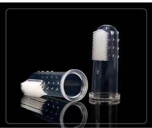 Detailed view of clear silicone finger toothbrush for pet oral care on black background