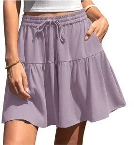 Detailed shot of a purple tiered mini skirt with an elastic drawstring waistband