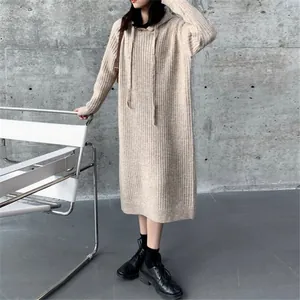 Casual oversized beige hooded knit midi dress for women featuring a cozy ribbed texture.
