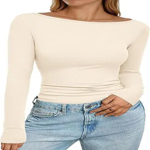 Close-up detail of women's cream boat neck ribbed knit top with slim fit design