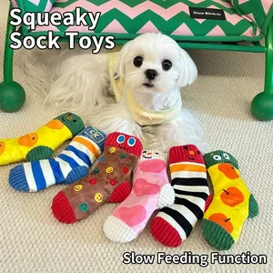 Close-up of colorful plush sock-shaped dog squeaky toys with hidden treat pockets.
