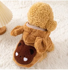 Detail shot of the cute teddy bear design on a fluffy brown plush dog winter vest
