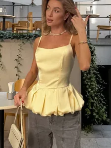 Elegant yellow satin sleeveless peplum camisole top for women stylish summer outfit