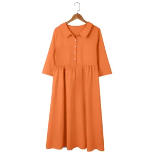 Detailed view of women's orange cotton linen loose casual dress on a hanger