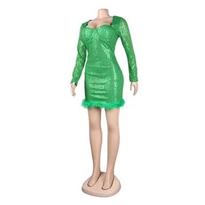 Detailed view of bright green sequined fabric with plush feather trim on a sexy mini dress