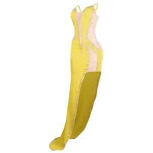 Detailed side view of yellow evening gown featuring mesh panels and rhinestones