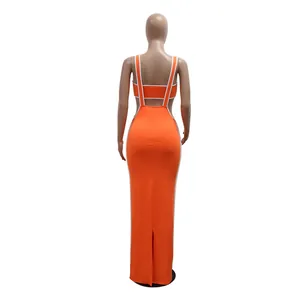 Back view of elegant orange two-piece set featuring sexy crop top and long bodycon skirt