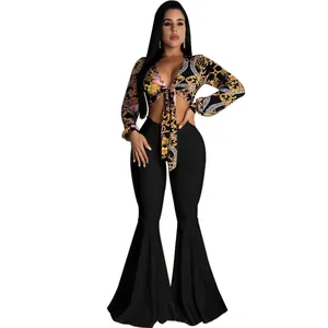 Sexy two-piece set featuring a floral tie-front crop top and black bell-bottom flare pants.