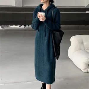 Chic oversized hooded knit maxi dress in deep teal for a cozy autumn look.