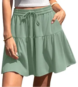 Lightweight sage green tiered mini skirt with elastic drawstring waistband for women