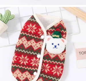 Close-up of Christmas pet vest with knitted pattern and plush bear detail