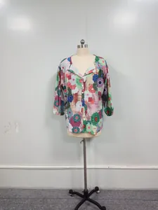 Detailed view of a stylish women's colorful floral print V-neck blouse on a mannequin
