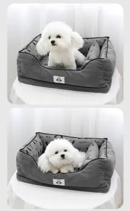 Cozy grey corduroy pet sofa bed with a cute white dog resting comfortably
