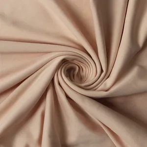 Primo piano di alta qualità di tessuto a rete beige con elegante dettaglio a spirale
