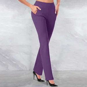 Detail showing the pockets and slim fit of these purple high-waisted yoga pants on model