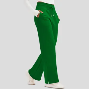 Side view detail showing the drape of women's lightweight high-waisted green wide-leg trousers