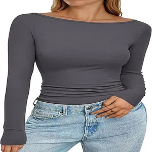 Detail view of a charcoal grey boat neck ribbed knit slim fit long sleeve top for women