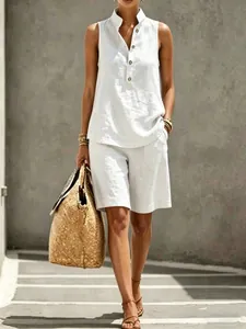 Detail of a chic white linen sleeveless top and shorts set for summer vacations