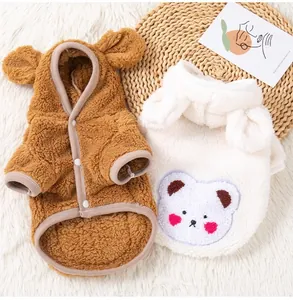 Close-up showing soft fleece texture of cute bear-themed winter pet hoodies in two colors