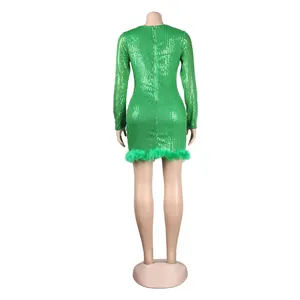 Detailed back view of a sexy green sequin mini dress with feather hem and zipper.