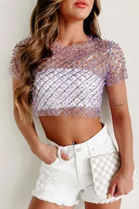 Close-up view of a sexy purple mesh crop top featuring exquisite sequins and pearl bead details