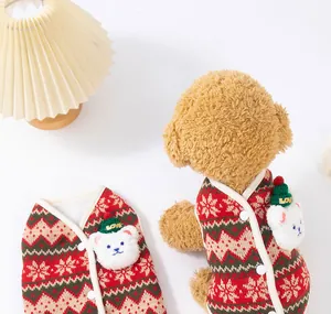 Detailed view of red Christmas knit dog vest featuring a plush bear and snowflakes