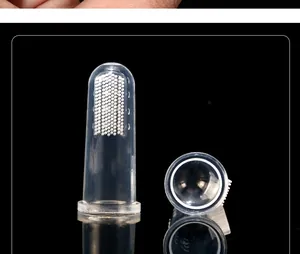 Macro view of clear silicone pet finger toothbrush showing soft cleaning bristles