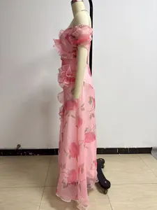 Side view of pink floral French vintage off-shoulder dress with ruffled details