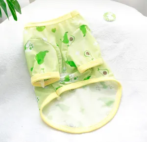 Detailed view of breathable green mesh dog vest with avocado print and yellow trim