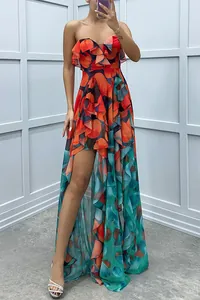 Detail of strapless ruffled mesh maxi dress with vibrant abstract floral print.