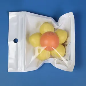Rotating flower-shaped catnip ball toy for cats presented in its protective white packaging