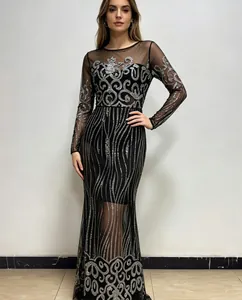 Detail view of a black floor-length dress with silver sequin scrollwork patterns