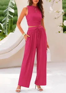Two-piece pink ribbed knit set with sleeveless top and drawstring wide-leg pants