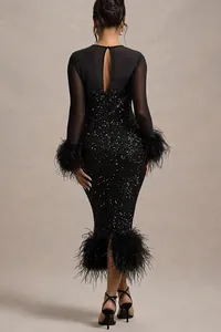 Back view of an elegant black sequined party dress with feather cuffs and hem