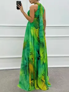 Floral print sleeveless halter neck maxi dress with elegant tie back and flowing hem