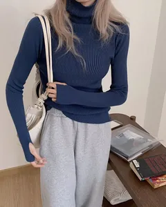 Detail shot of navy blue ribbed turtleneck knit sweater featuring unique thumb hole cuffs