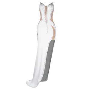 Detailed view of white rhinestone sleeveless evening gown with sheer panels.