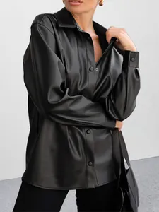 Stylish oversized black PU leather shirt jacket for women with a vintage aesthetic.