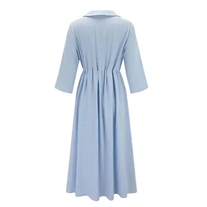 Detailed back view of a light blue casual cotton linen dress featuring elegant waist pleats