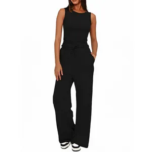 Completo donna nero con top senza maniche girocollo e pantaloni larghi a vita alta