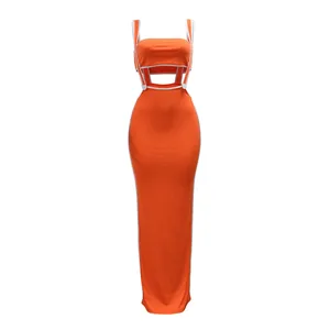 Front view of sexy orange two-piece set with crop top and bodycon maxi skirt