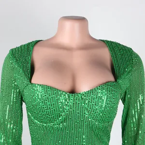 Detailed view of a green sequined bodycon dress featuring a sexy sweetheart neckline.