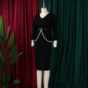 Elegant black peplum pencil dress with white trim and long sleeves for office wear