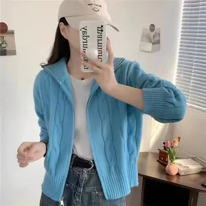 Stylish blue cable knit zip-up cardigan for women featuring a cozy high neck design