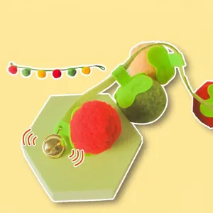 Tomato and persimmon themed cat toy with colorful felt balls and a small metal bell