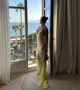 Elegant pale yellow backless V-neck sequined mermaid evening gown for luxury events