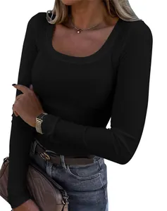 Detailed view of the black ribbed fabric and elegant square neckline of this slim fit top.